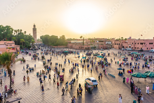 MARRAKECH, MOROCCO, SEPTEMBER 3 2018: Sunset over the big crowd of Djemaa El Fna market square