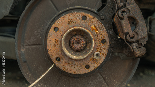 Old rusty parts of a car wheel