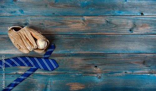 Photography Old baseball glove, ball and neck tie on faded blue wood for happy fathers day c