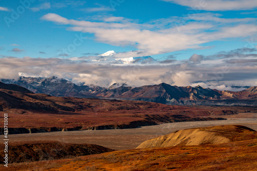 dramatic landscape of  mountain peaks and mountain ranges inside Denali National Park  during autumn season.