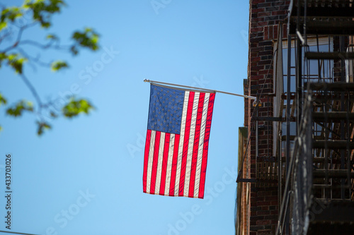 view of the United States flag on a apartment building in Queens, New York