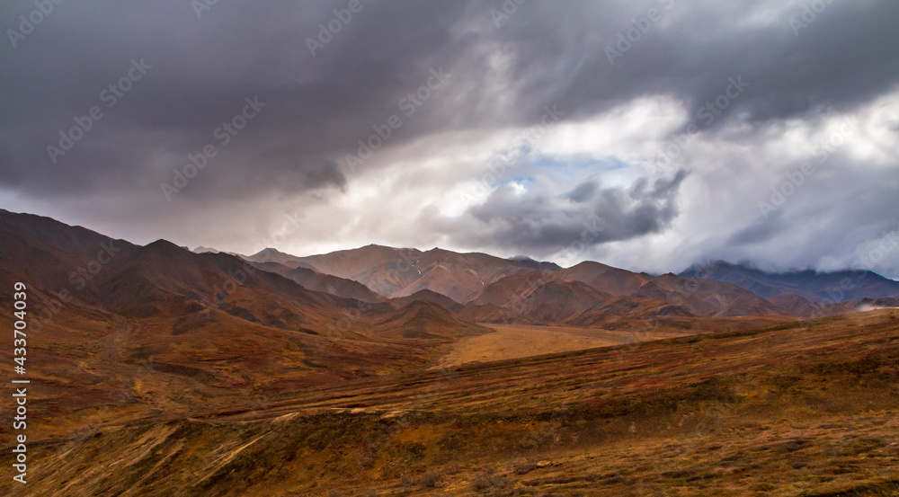 dramatic landscape of  mountain peaks and mountain ranges inside Denali National Park  during autumn season.