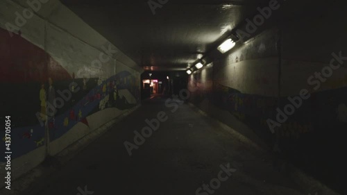 A dark and lonely way home in a tunnel, first person perspective
