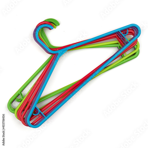 Empty clothes hanger, multicolored plastic coat hangers. Shop and wardrobe accessories. Fashionable shopping bright concept