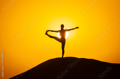 Wallpaper Mural Silhouette of a young woman doing yoga pose at sunset Torontodigital.ca