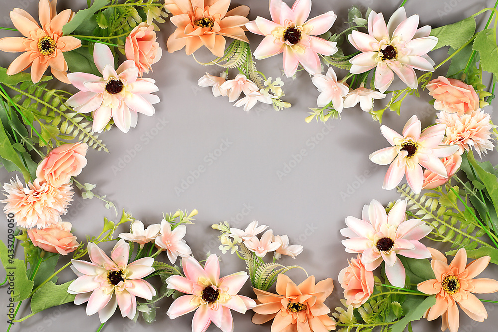 Abstract floral composition flat layout, the background, the concept of minimum holiday with flowers, spring banner. Lotus flowers on a gray table. Mother's day card, happy birthday, wedding,