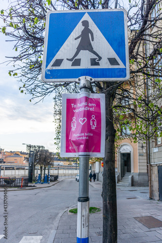 Photography Laminated paper sign with a reminder about keeping distance because of spreading