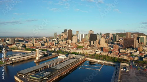 Aerial Drone of Downtown Montreal  on Sunny Day. Camera Pushes In to the Old Port of the City Centre in Quebec's Capital