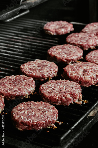 raw burger cutlets - cutlets made from organic beef on a grill. raw cutlets. 