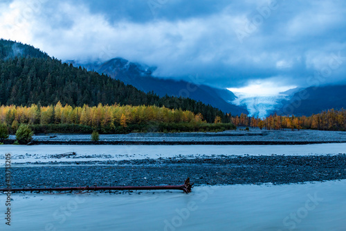 dramatic, moody sky during autumn sunset in the Exit Glacier in Kenai Ffjords national park , Alaska. photo