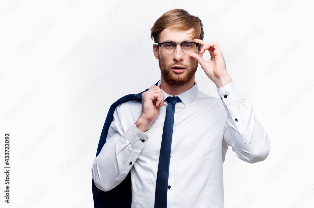 business man with a jacket over his shoulders wearing glasses self-confidence official business man with a jacket over his shoulders wearing glasses self-confidence official