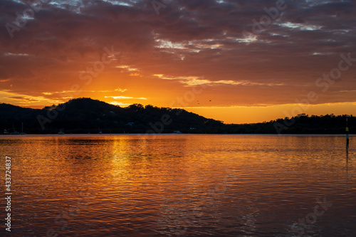 Sunrise waterscape with clouds