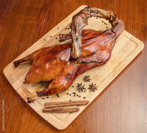 The grilled pecking duck on the table photo