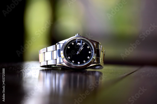 luxury watch with green dial It is a wrist watch for business people.