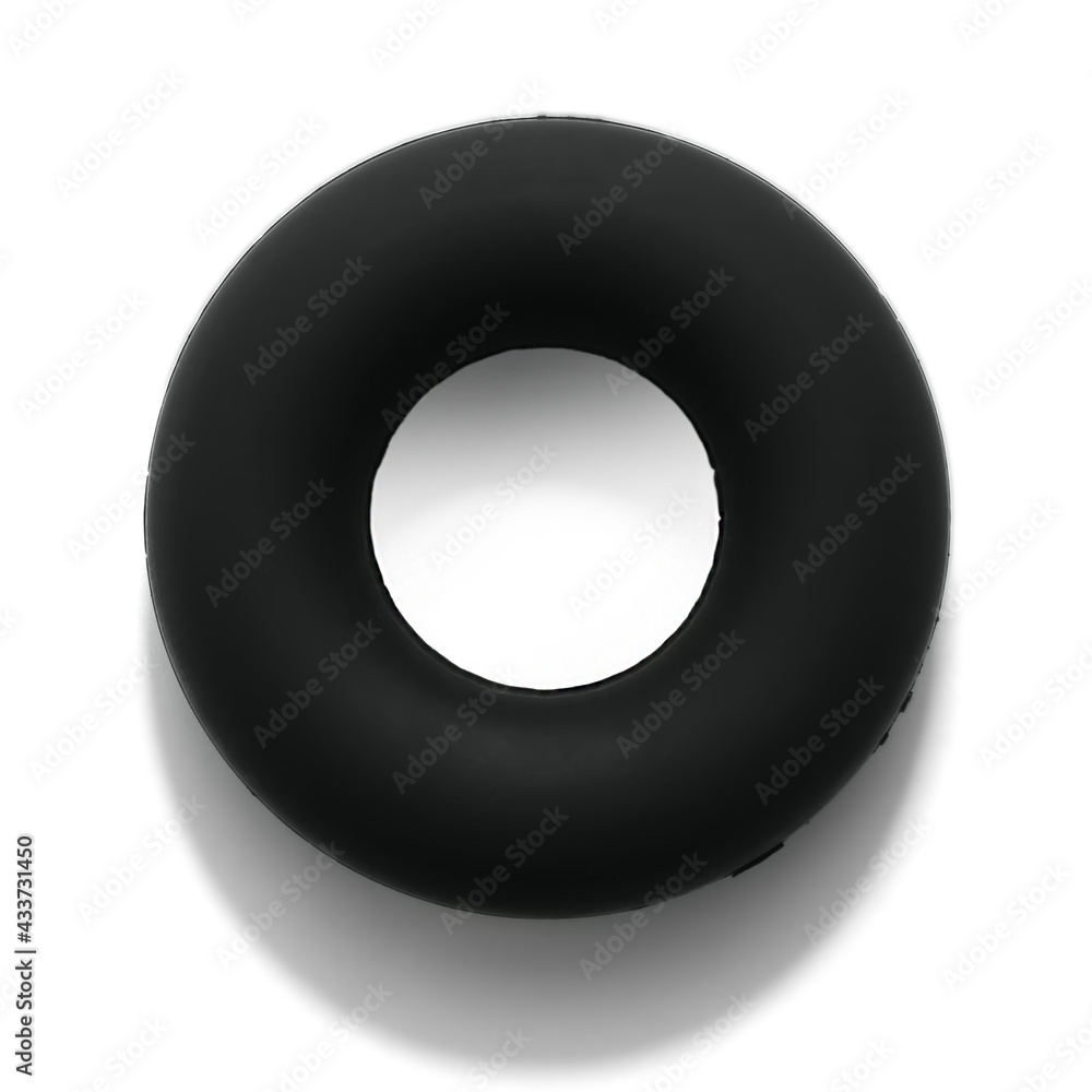 Hand expander for hand training. Sports equipment in the form of a black rubber ring to develop grip strength. Hand expander for hand training. Sports equipment in the form of a black rubber ring to develop grip strength.