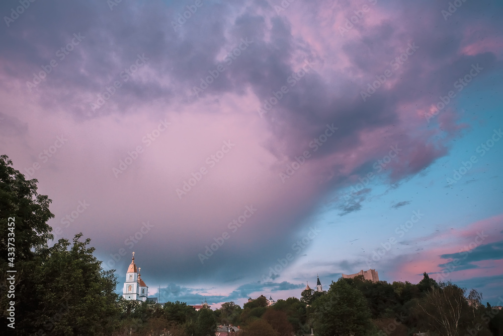 Fototapeta premium City church on light background. Old town. Scenic cityscape.