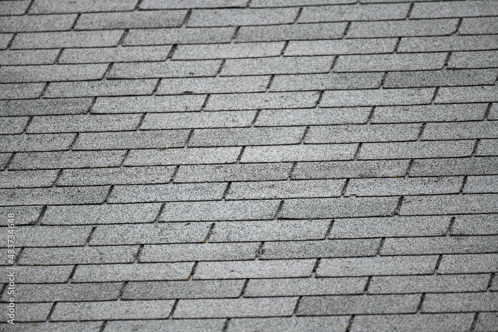 close up on gray roof shingle background close up on gray roof shingle background
