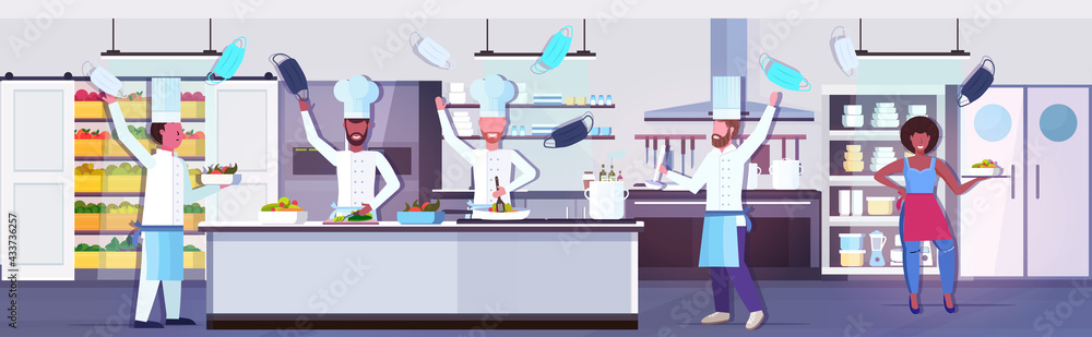 chef cooks taking off face masks coronavirus quarantine is ending victory over covid-19 concept chef cooks taking off face masks coronavirus quarantine is ending victory over covid-19 concept