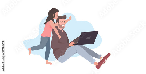 father using laptop spending time with daugter during coronavirus pandemic quarantine stay home