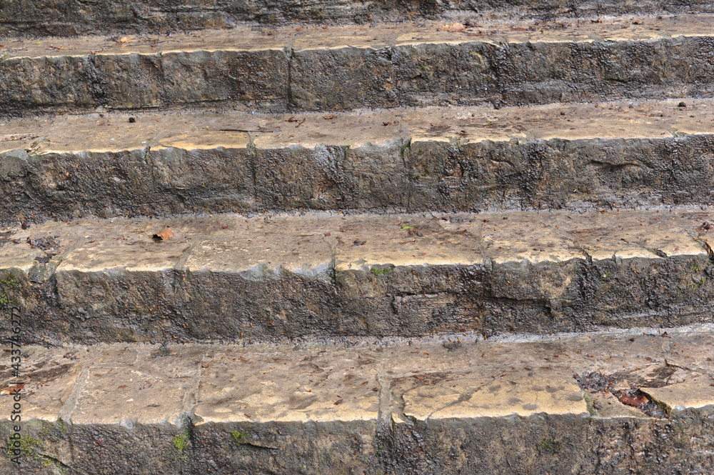 Old and antique stone stairs with sharp steps Old and antique stone stairs with sharp steps