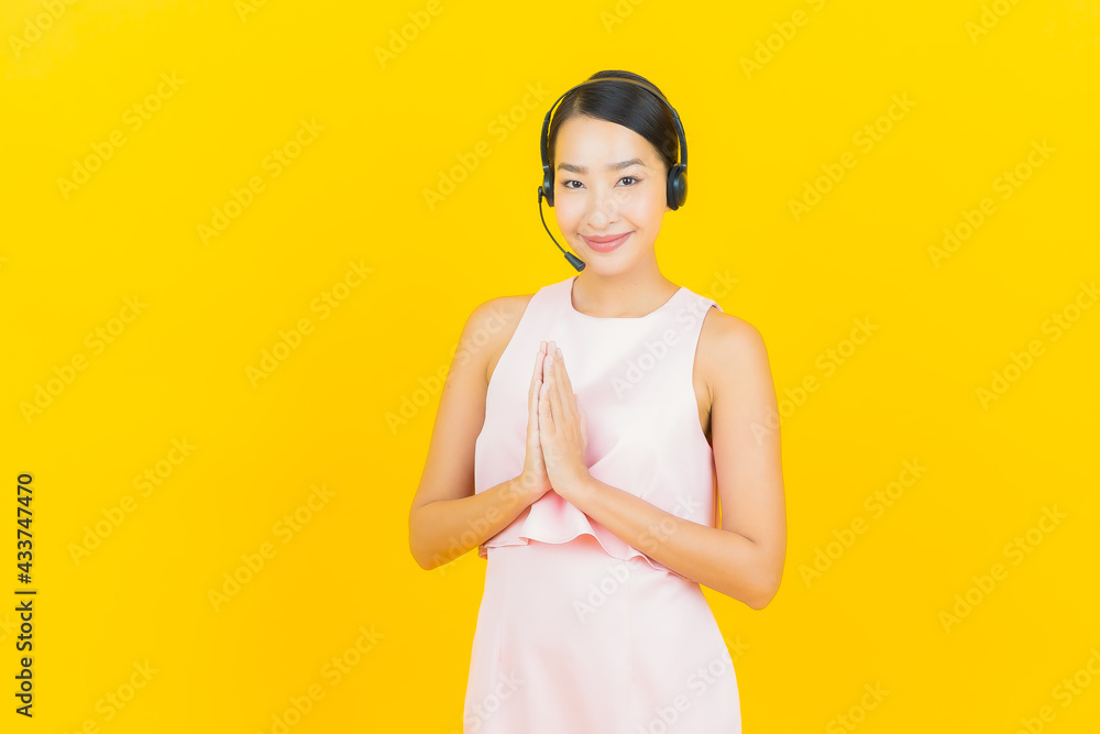 Portrait beautiful young asian woman with call center customer care service center Portrait beautiful young asian woman with call center customer care service center