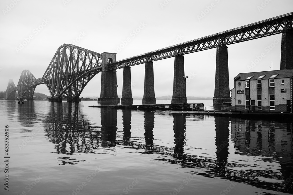 Tranquil black and white image of Firth of Forth rail bridge
