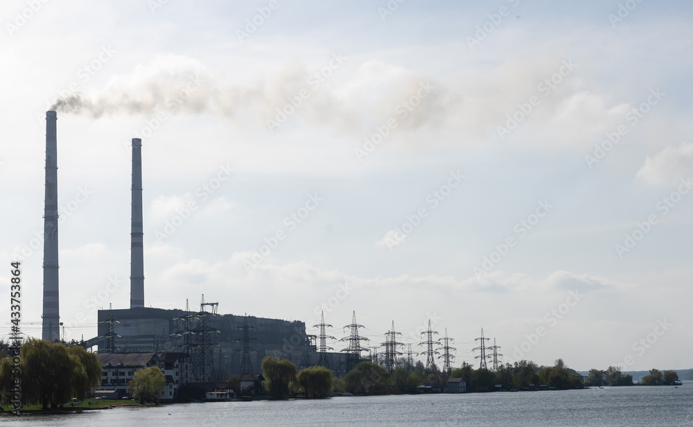 Panoramic view of power station Lukomlskaya Gres. Chimneys with smoke of power plant. Ecological problem. Environmental pollution concept.