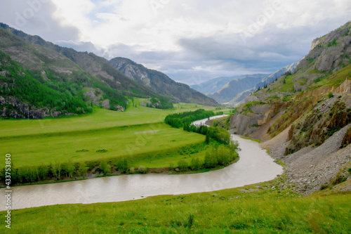 Beautiful landscape, green valley, mountains, river © Zhanna