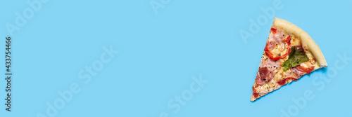 slice of hot fresh pizza lies on a blue background. Top view, flat lay. Banner