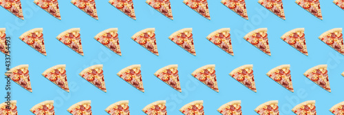 background of slices of hot fresh pizza on a blue background. Top view, flat lay. Banner