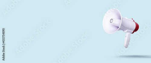 white megaphone flies on a light background. Advertising and messages concept. Banner