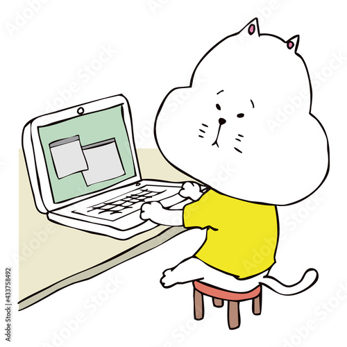 パソコンを使っている猫