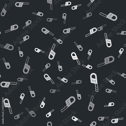 Grey Reciprocating saw and saw blade icon isolated seamless pattern on black background. Vector