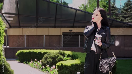 European Girl Businessman Drinking Coffee in the Street