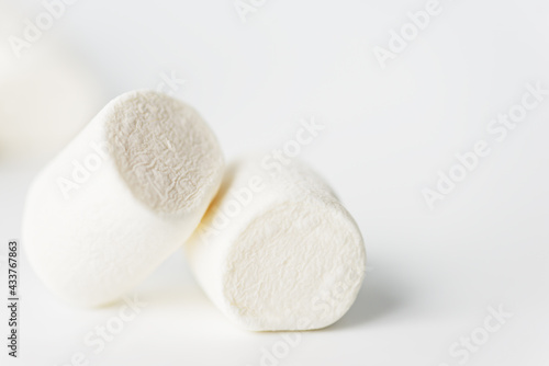 White marshmallows on a light background. Selective focus.