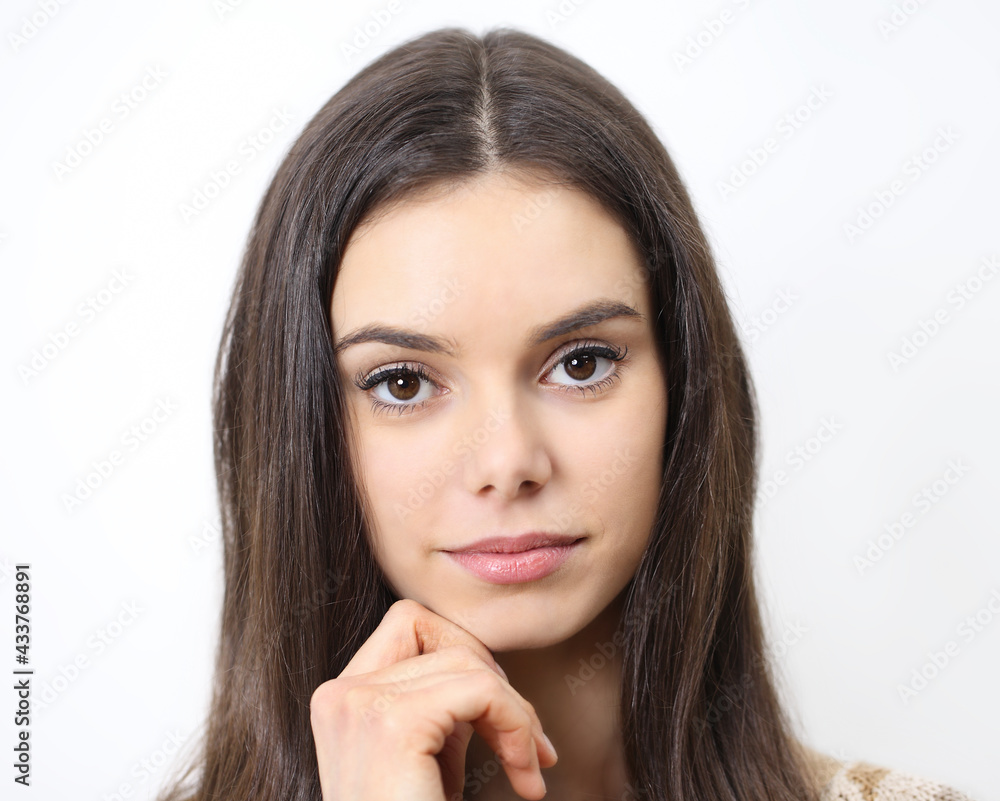 Portrait of beautiful brunette young woman with brown eyes isolated on white background close up Portrait of beautiful brunette young woman with brown eyes isolated on white background close up