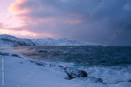 Cloudy weather conditions in the Arctic region, natural scenery along the Arctic Ocean. Winter nature background picture.