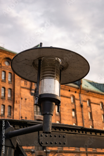 a close-up of a streetlight in the harbor of hamburg, respectively the speicherstadt, photographed during daytime