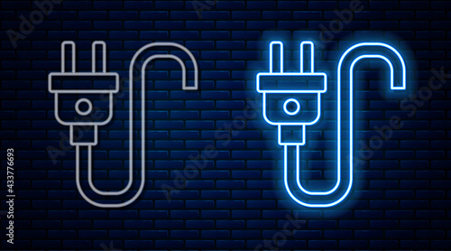 Glowing neon line Electric plug icon isolated on brick wall background. Concept of connection and disconnection of the electricity. Vector