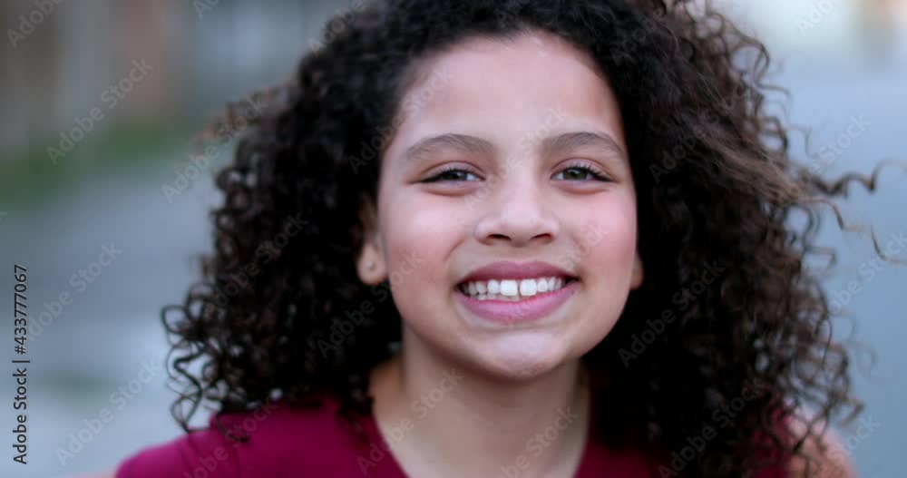 Beautiful diverse little girl child smiling at camera portrait face Beautiful diverse little girl child smiling at camera portrait face