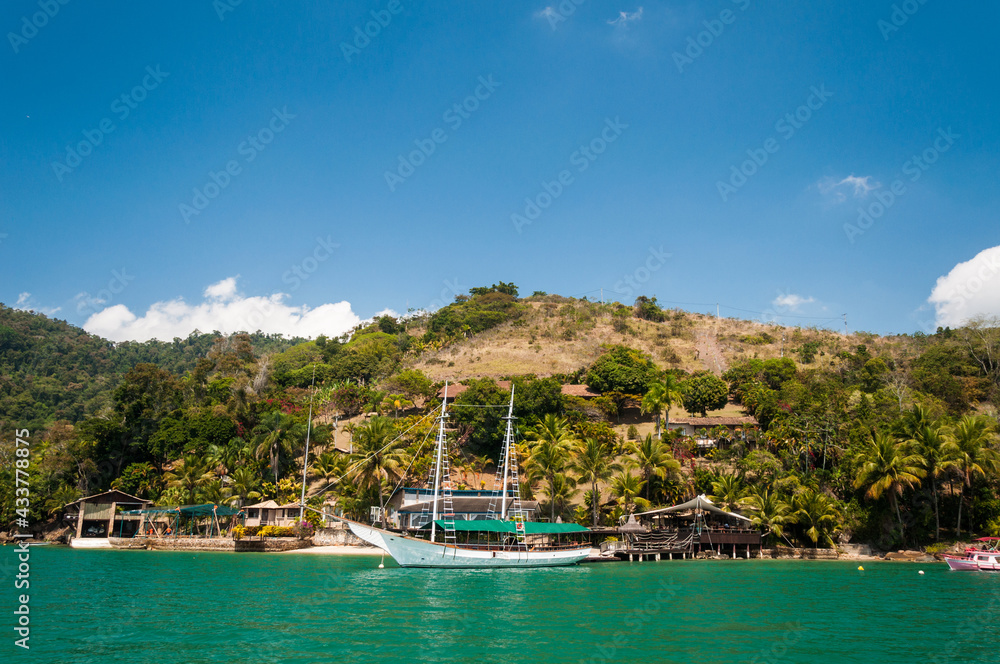 Vacation at the sea of Paraty (Rio de Janeiro) with vessel on a sunny day. Clean and transparent water.