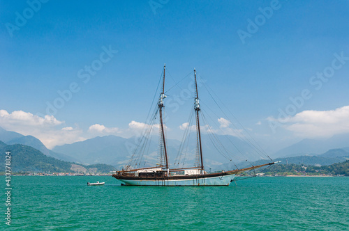Vacation at the sea of Paraty (Rio de Janeiro) with vessel on a sunny day. Clean and transparent water.