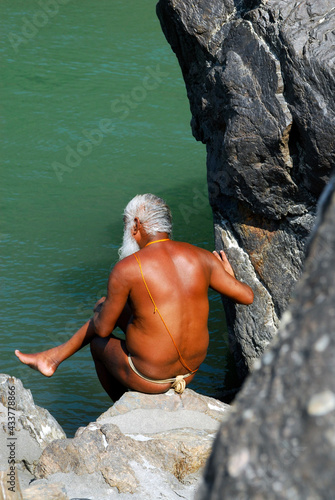 Pilgrims and Sadhus worshiping and having holy bath at Ganga river Haridwar , Uttarakhand , India.  