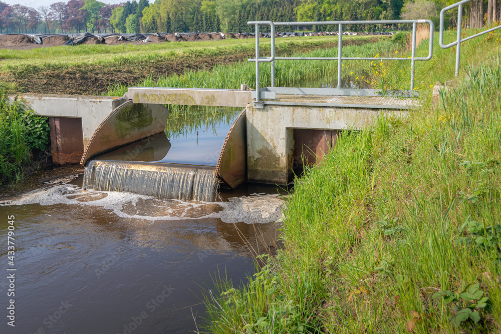 Small metal weir in a Dutch polder ditch