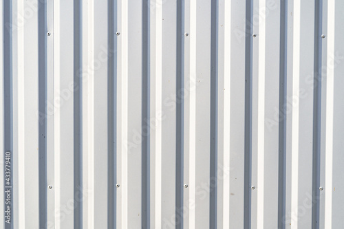 White corrugated metal wall texture. Vertical lines