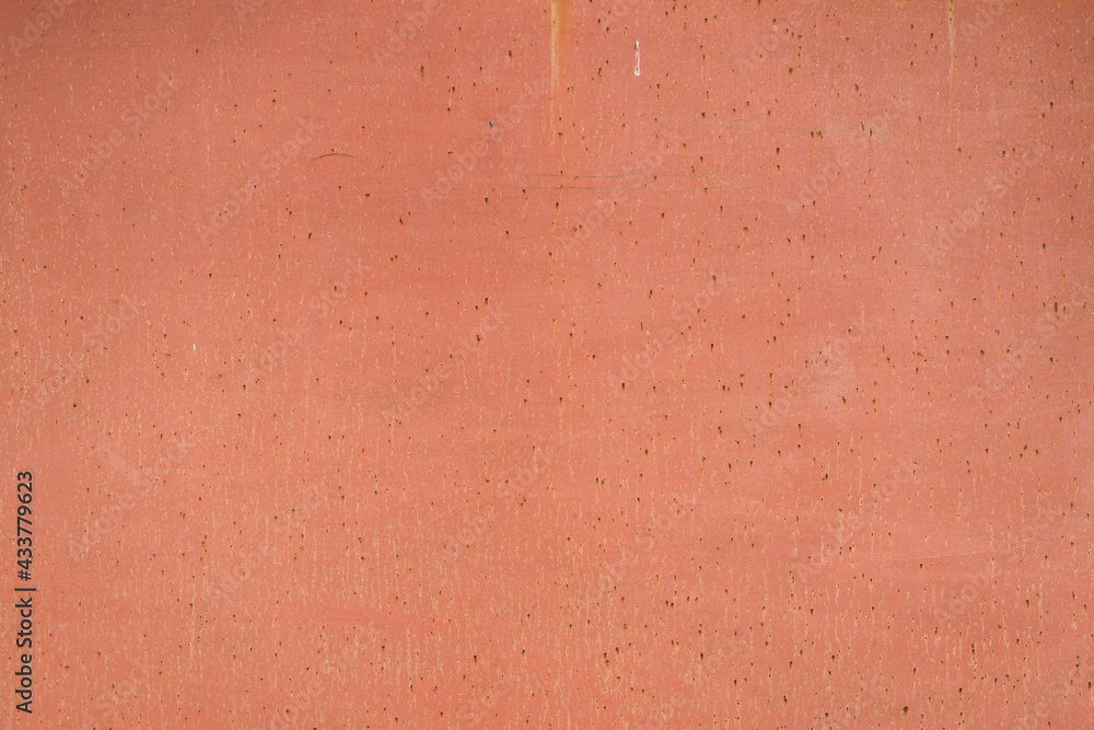 Fototapeta premium Painted in orange old cracked metal rusted background. Metal texture. Erosion metal. Scratched and dirty texture on outdoor metal wall.