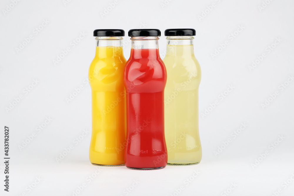 Glass fruit juice bottle isolated on white background. Glass fruit juice bottle isolated on white background.