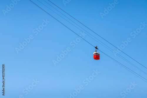 Barcelona in movement cablecar picture taked in a sunny day with a beautiful blue clear sky.