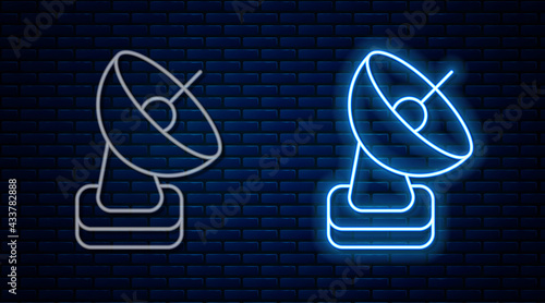 Glowing neon line Radar icon isolated on brick wall background. Search system. Satellite sign. Vector