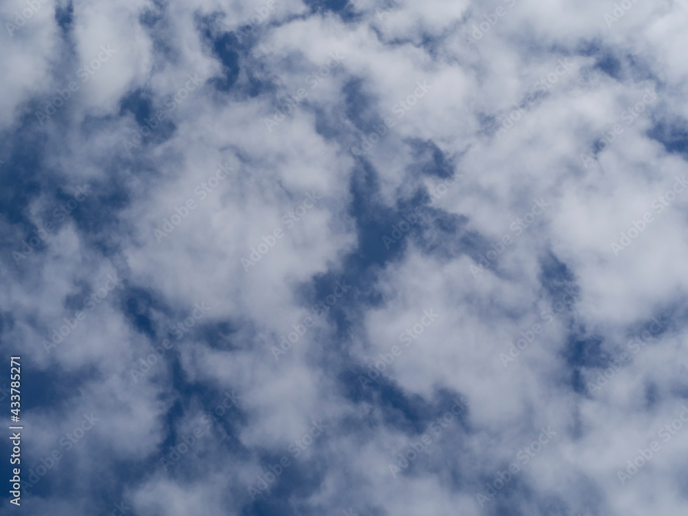 Background blue sky with white clouds, bottom-up view Background blue sky with white clouds, bottom-up view